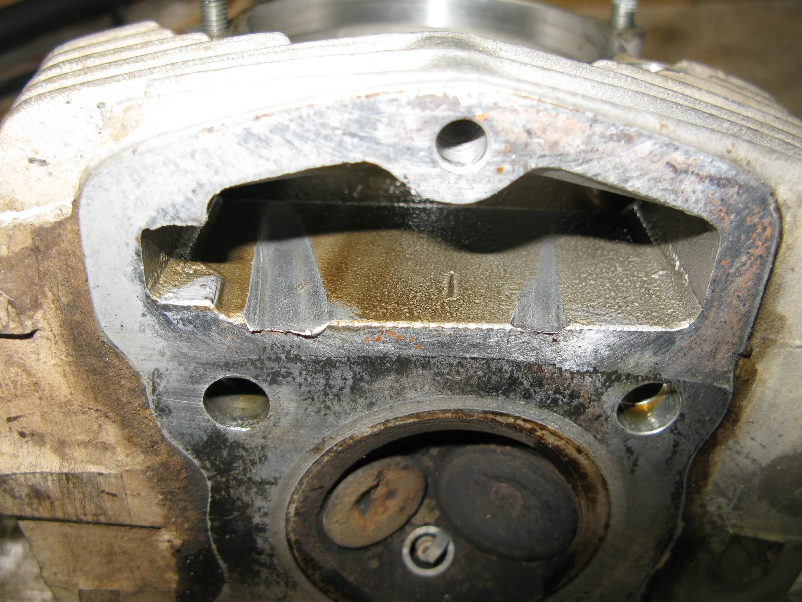 Scoring from the cam chain in head.
